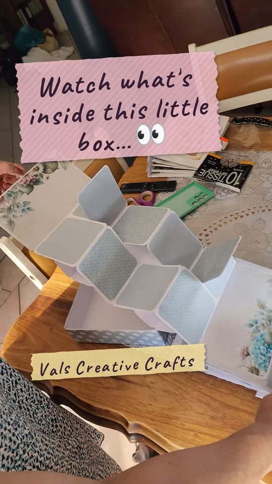 A handmade gift box opening into a photo album