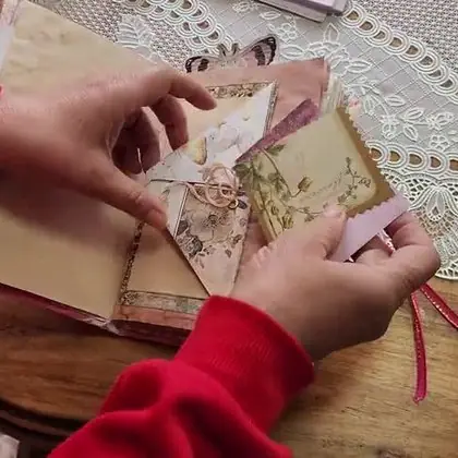 Val's hands working on a page